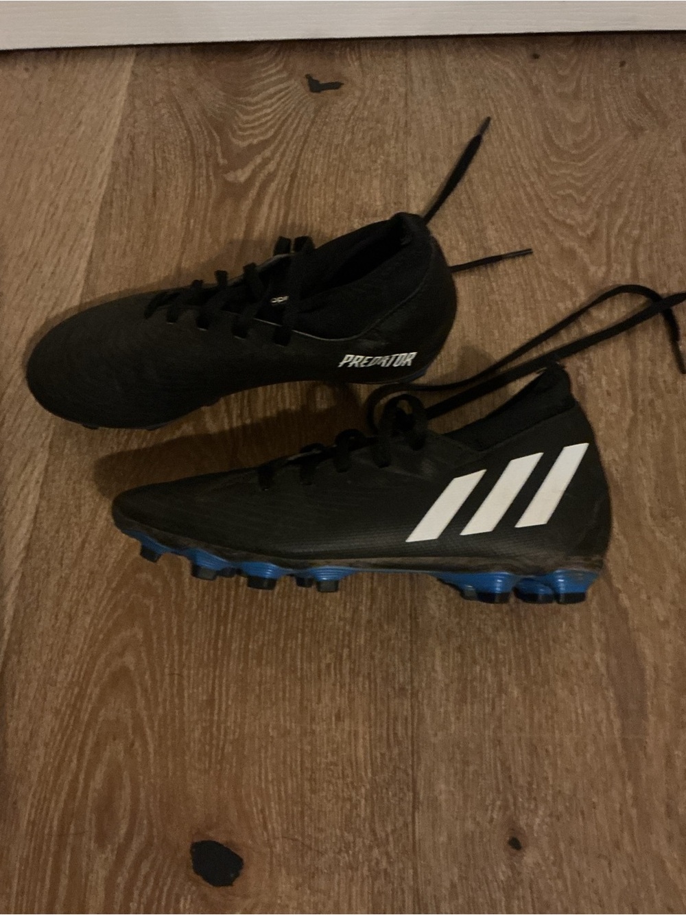 adidas Black Cleats with White Stripes and Blue Studs